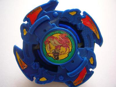 A beyblade, a small circular toy.
